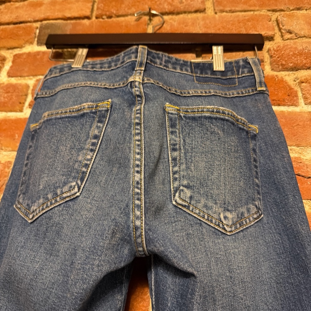 AMO cropped button fly, tapered raw hem